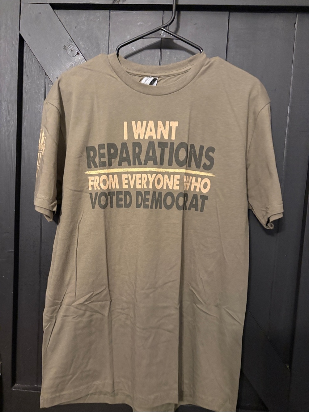 Next Level Apparel Olive Green Political Graphic Tee with Cream & Dark Gray Text